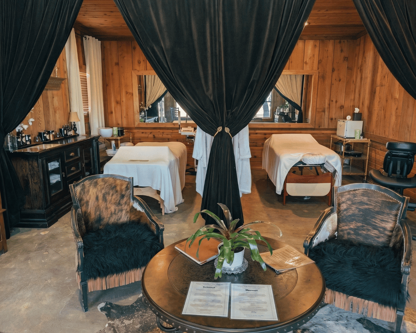 Cozy spa room with two massage beds and elegant decor at Wild Atter Ranch.